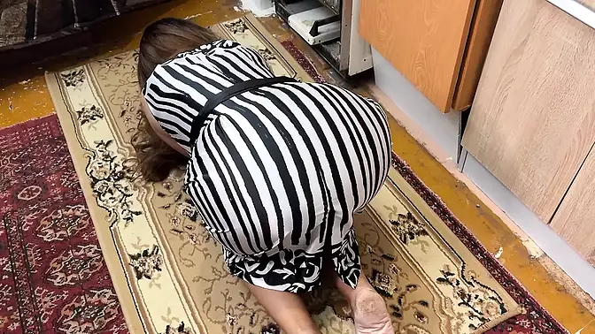 On the floor, a housewife is on her knees and feels a schlong in her booty when she has butt sex sex