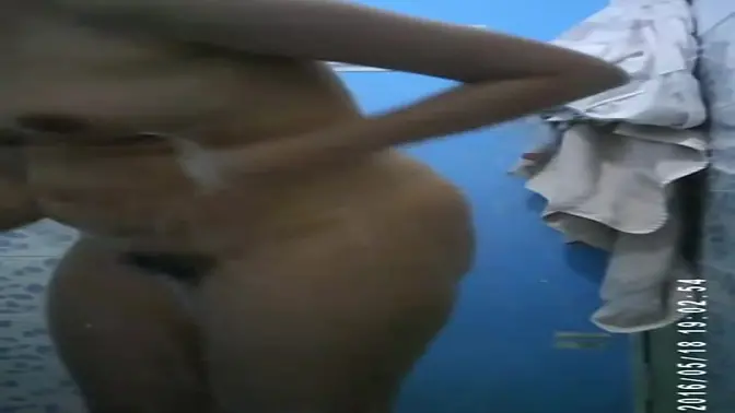 Spying on a gorgeous babe at the girl's dorm