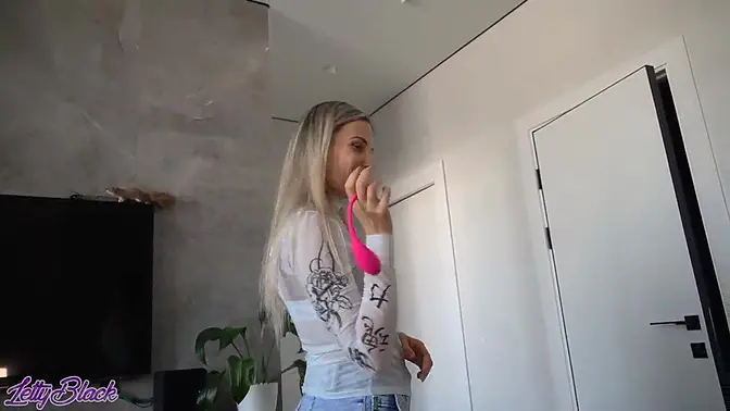 Pretty blonde Letty Black gets off on her remote controlled vibe in crowded cafe