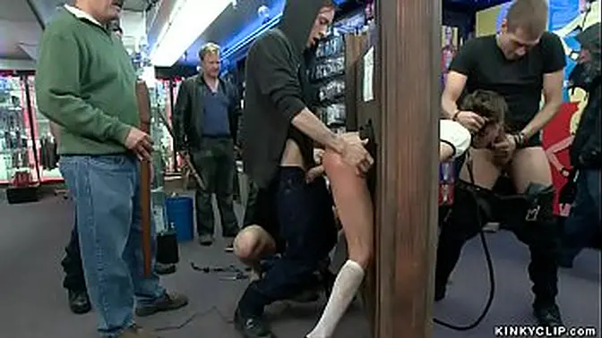 Sexy brunette doll Riley Reid is public d  by mistress Chanel Preston then made to gangbang fuck by big cock Xander Corvus and stranger while she is locked in stock wall