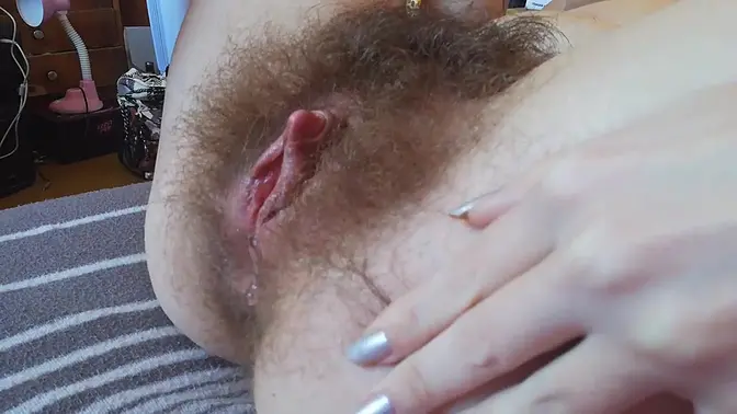 Amateur teen with hairy bush gets her clit stimulated to a real orgasm