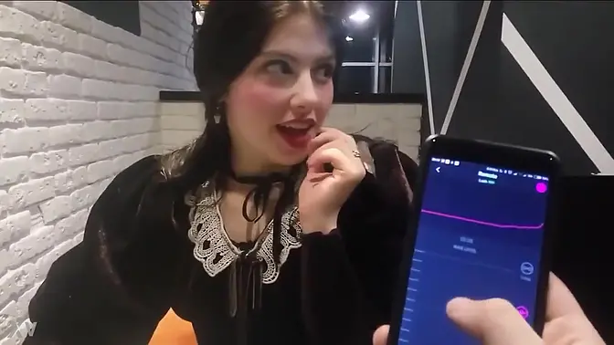 Girl gets teased with Ohmibod at restaurant
