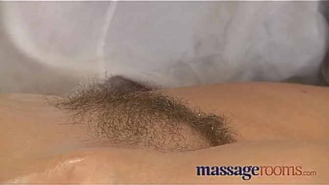 Older woman's hairy pussy gets teased to climax during a sensual massage
