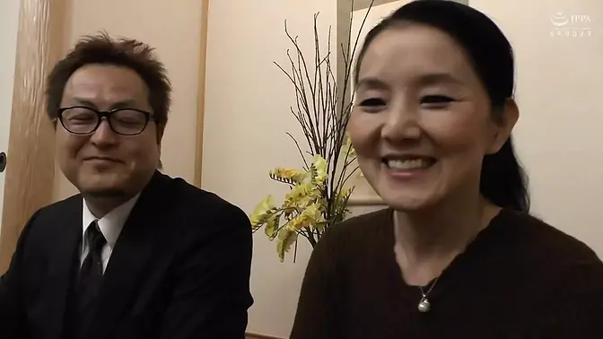 Japanese MILF films herself and her husband having passionate doggy sex