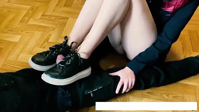 Young teen with long legs teases with her sneakers