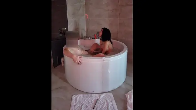 Sexy babe gives a wet blowjob in the jacuzzi bathtub