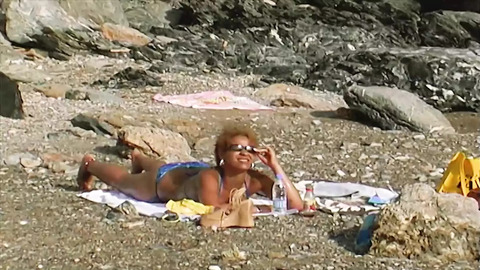 A beachside black stallion gets pounded by a passionate ebony mistress