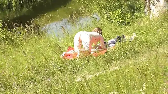 Sexy MILF sunbathing nude, lucky guy watches her perfect body