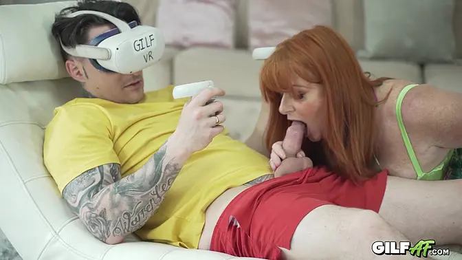 Redheaded MILF's pussy gets pounded by young cock