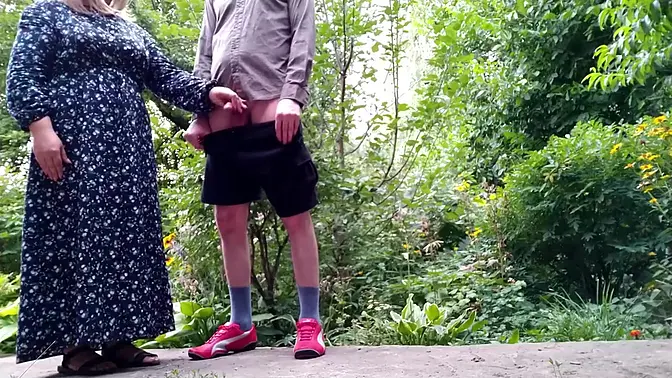 Step mom helps step son pee and pees while standing in public