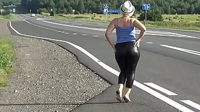 Beautiful blonde babe showcases her big ass in leather leggings