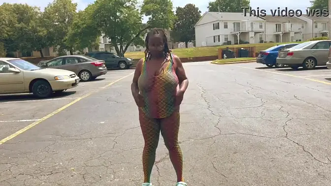 Naughty babe flashes her big tits in public