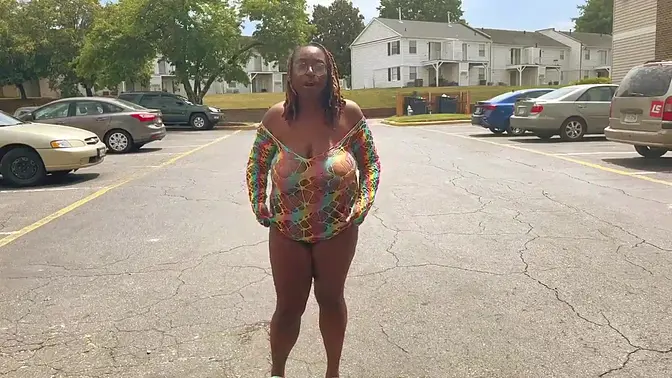 Naughty babe flashes her big tits in public