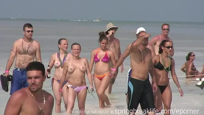 Twin sisters strip and show off their boobs in the pool