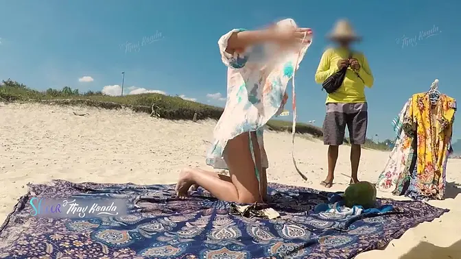 Sultry Latina milf flashes big tits for beach vendor