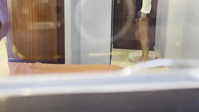 MILF masturbates through the window