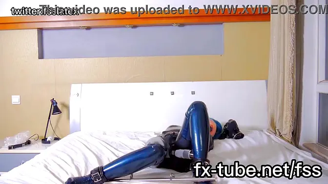 Bound in latex, a submissive's intense orgasm