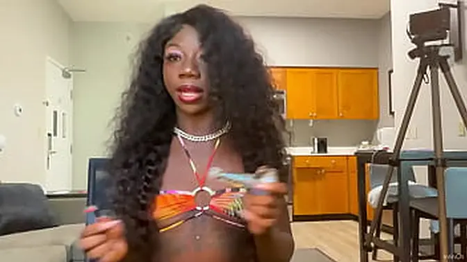 Ebony babe LOLA BLACK licks lollipop and wows with tattoos