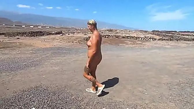 Nudist couple explores abandoned building after beach