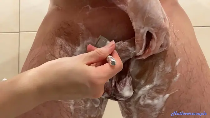 Milf sucks and jacks off a guy's bare balls