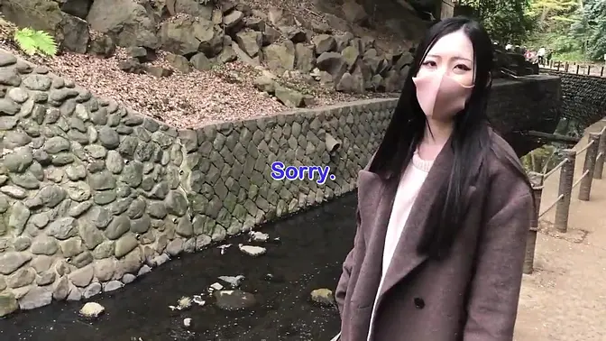 Slender Japanese girl gives handjob in forest
