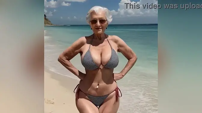 Naughty granny in bikini chats up young stud on the beach