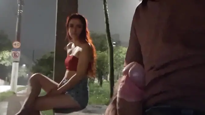 Hot redhead gets a handjob on the street