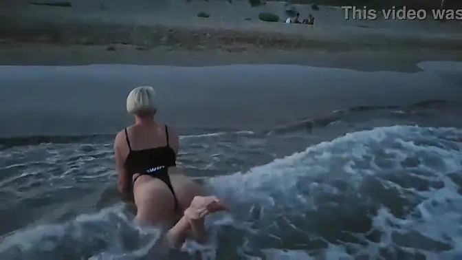 Real blonde sucks cock on public beach