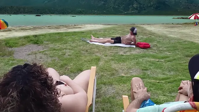 Sexy Latina wife flirts with beach voyeur while touching herself