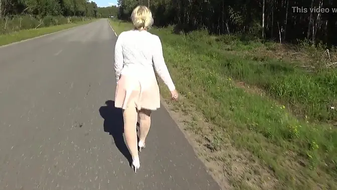 Beautiful blonde MILF in glasses teases with pantyhose-clad legs