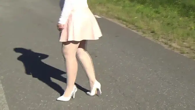 Beautiful blonde MILF in glasses teases with pantyhose-clad legs