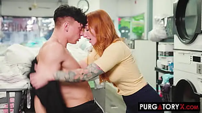 Busty redhead MILF pleasures a client in the laundromat