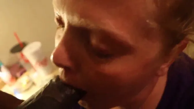 Redheaded milf swallows huge black cock and gets a facial