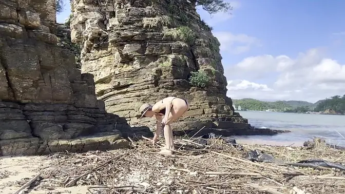 Beautiful blonde in sundress worships the beach