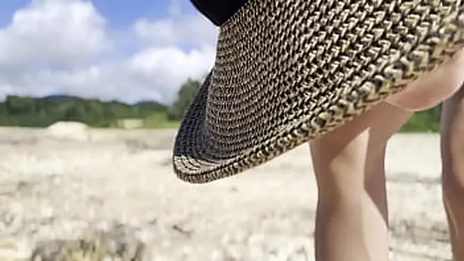 Beautiful blonde in sundress worships the beach