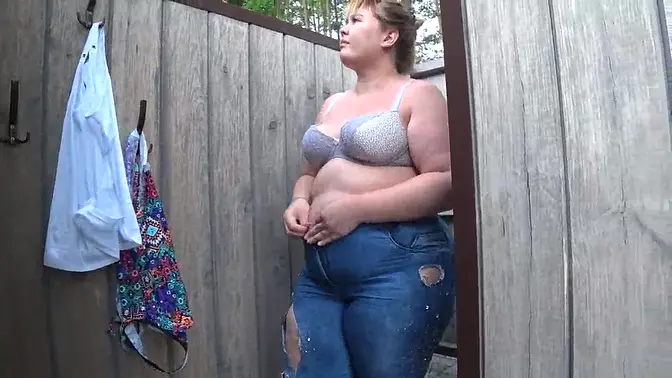 Solo chubby girl shakes it in a swimsuit on public beach