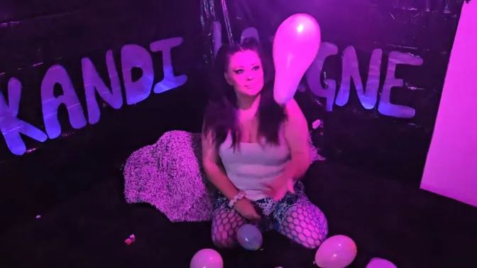 Mature woman with big natural tits pops balloons