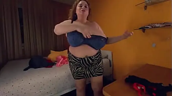 Busty MILF shows off her huge tits