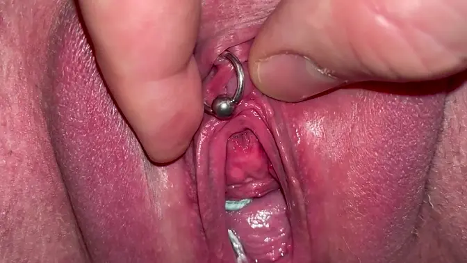 Amateur couple's pierced clit and pussy play with pissing