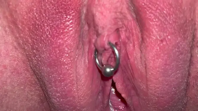 Amateur couple's pierced clit and pussy play with pissing