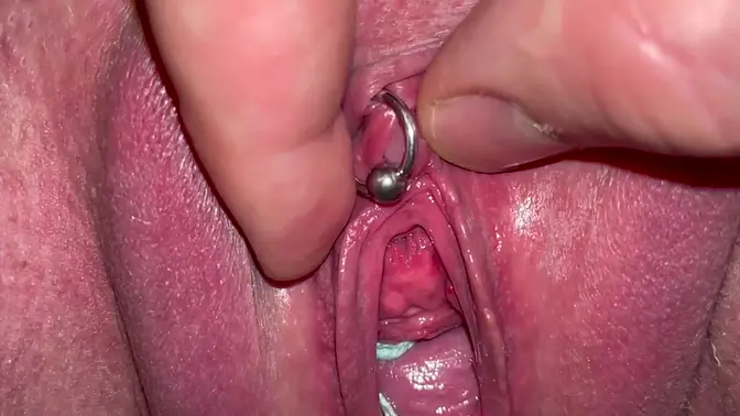 Amateur couple's pierced clit and pussy play with pissing