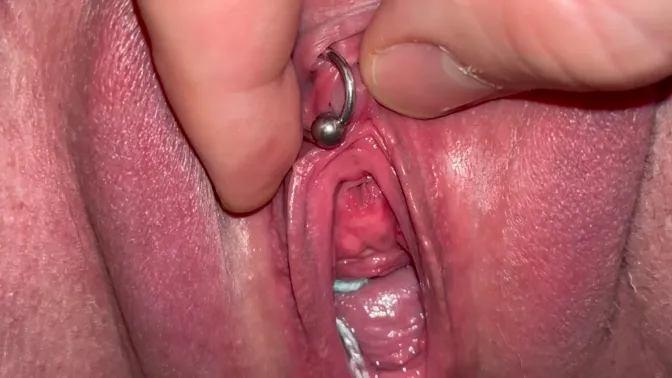 Amateur couple's pierced clit and pussy play with pissing