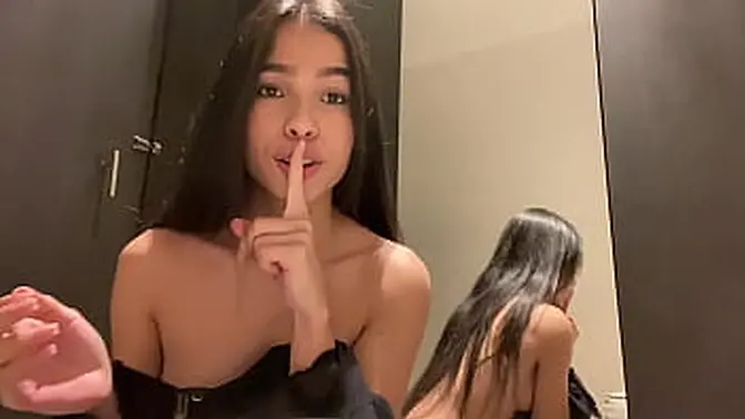 Brunette Latina teen squirts during public masturbation in dressing room